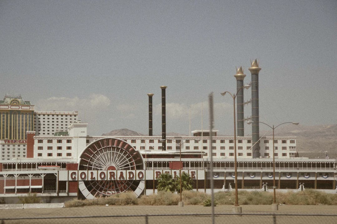 a large building with a ferris wheel in front of it
