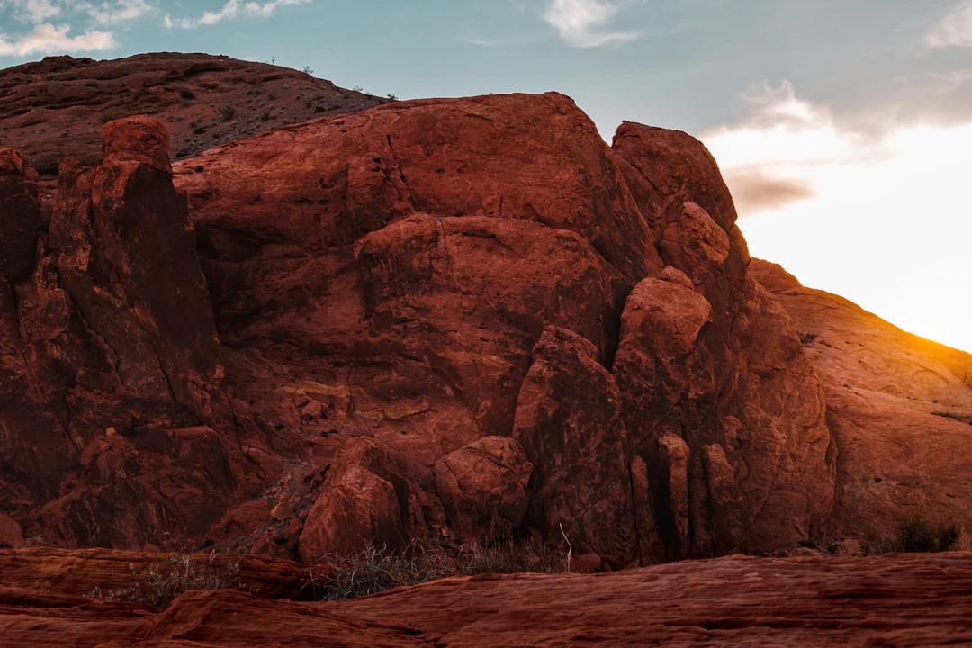 a large rock formation in the middle of a desert