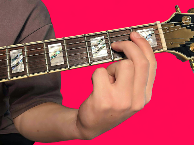 F major over E guitar chord with finger positions