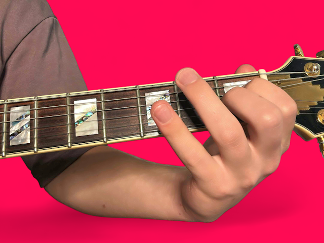 E major over D# guitar chord with finger positions