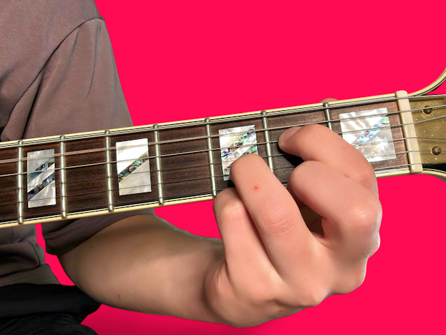 A7sus4 guitar chord with finger positions