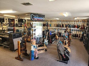 Backyard Guitars &Blue Collar Trading Post