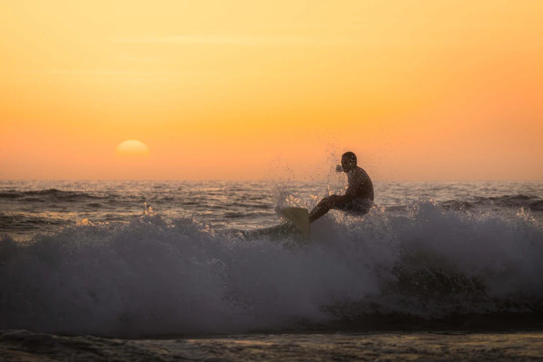 man surfing on seawave